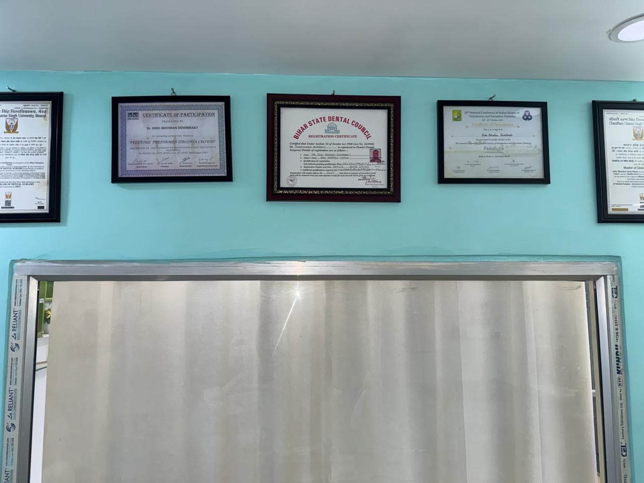 Dr. Indu Bhushan qualifications and certificates — Radha Dental Clinic